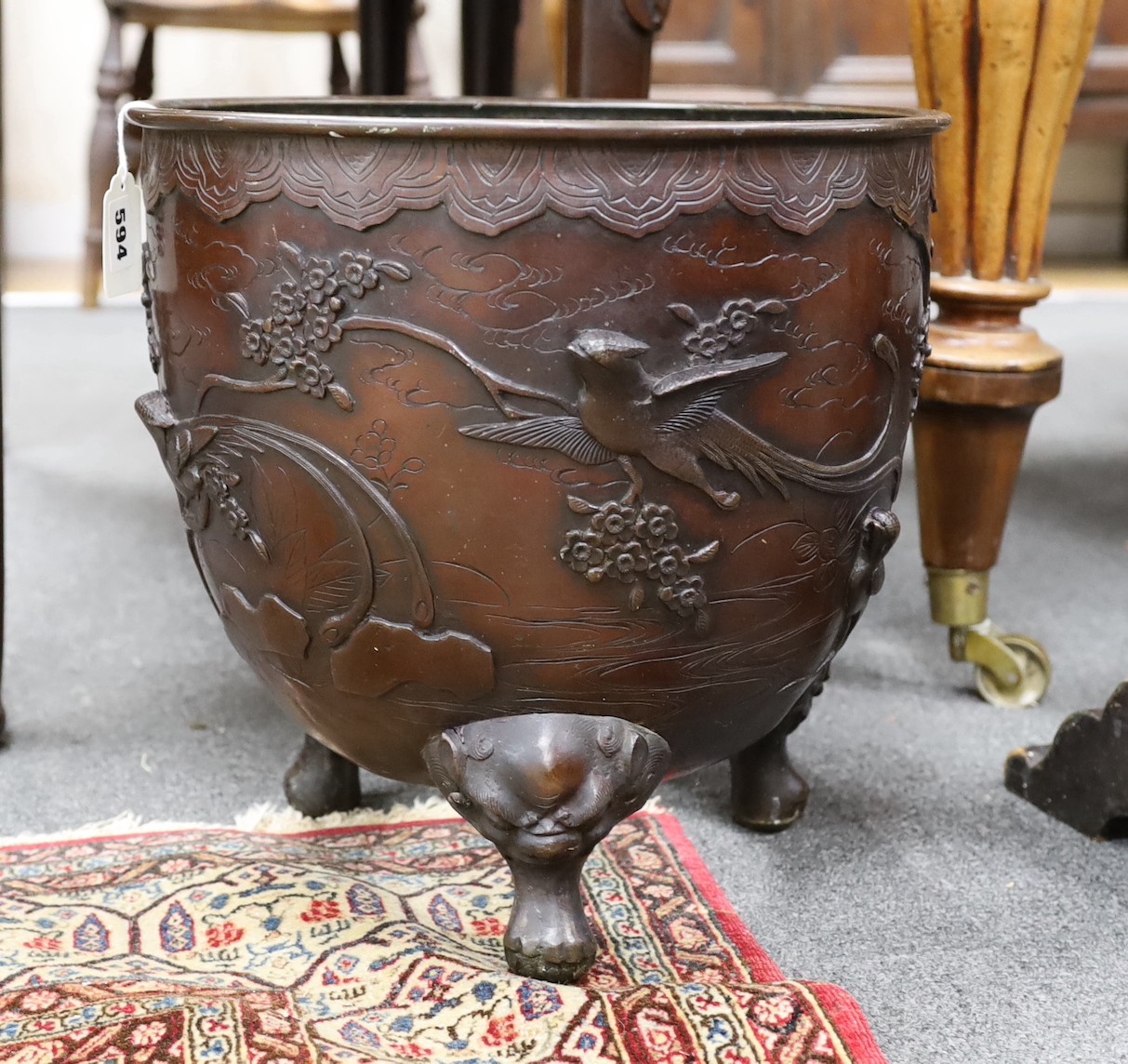 A Japanese bronze jardiniere, Meiji period, base lacking, 36cm high